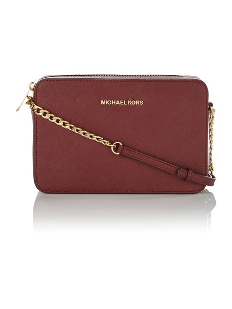 popular michael kors bag|Michael Kors maroon crossbody bag.